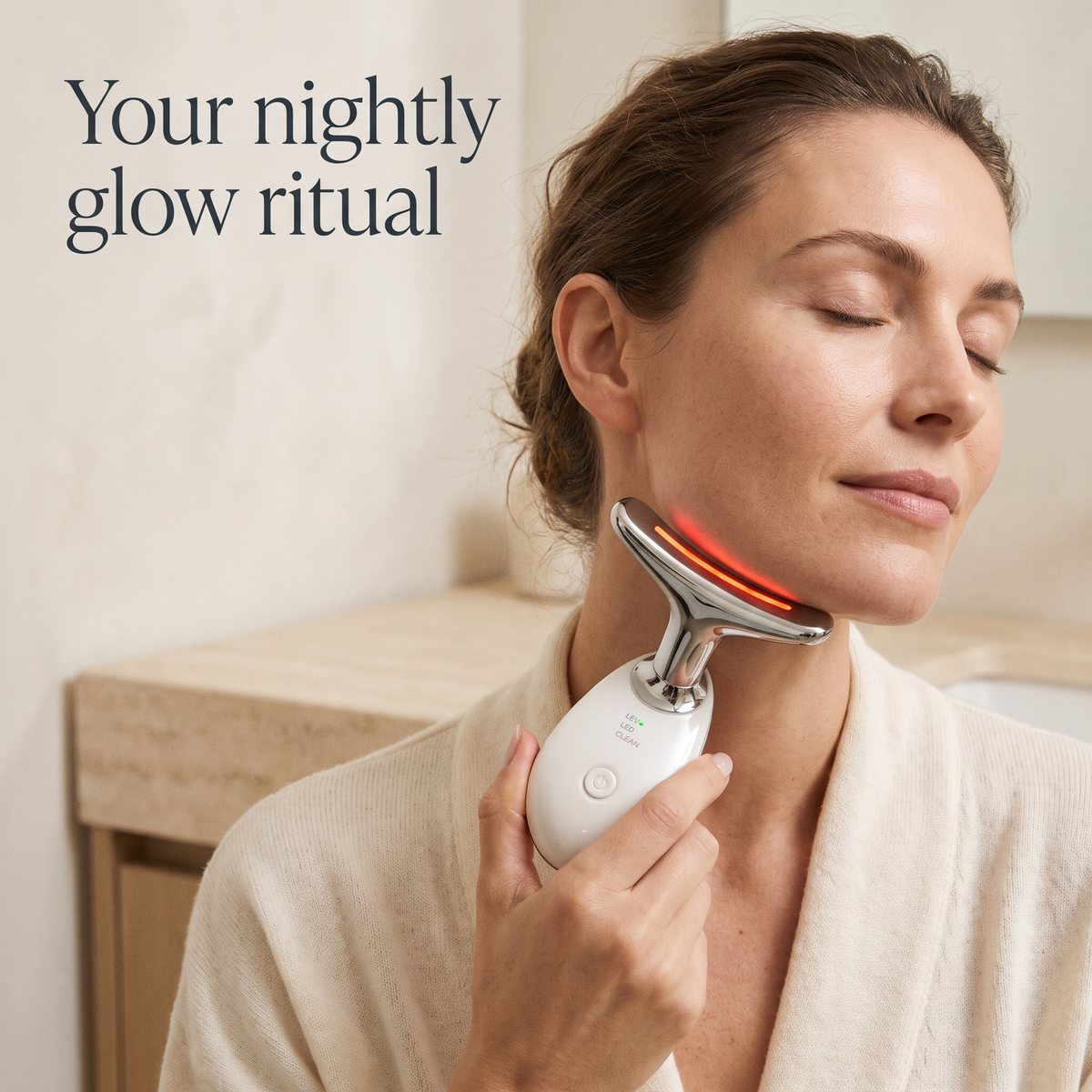 Woman using the Korvella Sculpt Wand along her jawline and neck